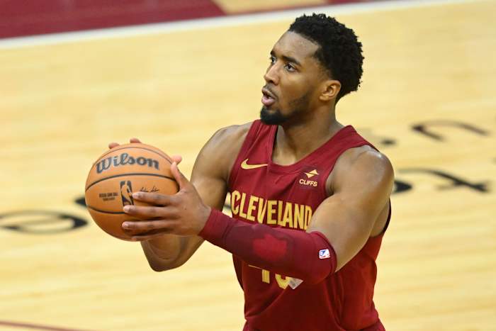 Feb 27, 2024; Cleveland, Ohio, USA; Cleveland Cavaliers guard Donovan Mitchell (45) shoots a free throw in the fourth quarter against the Dallas Mavericks at Rocket Mortgage FieldHouse.